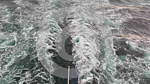 View of the wake of a cruise ship. Tourist ship sails on the sea or ocean