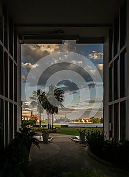 View from the walkway corridor inside the Residence building to the relaxing garden along the Chao Phraya River