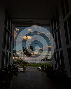 View from the walkway corridor inside the Residence building to the relaxing garden along the Chao Phraya River