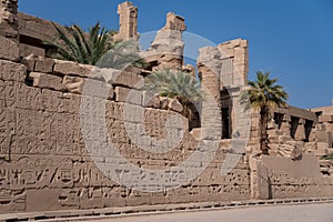 View of the wall with Egyptian hieroglyphs and ancient drawings at Karnak Temple. Luxor, Egypt