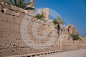 View of the wall with Egyptian hieroglyphs and ancient drawings at Karnak Temple. Luxor, Egypt