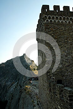View of the walls of the Genoese fortress. The tower with loopholes of the Genoese fortress. Sudak, Crimea.