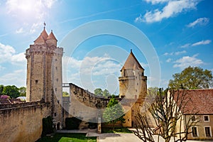 View from walls on towers of Blandy-les-Tours castle over sky