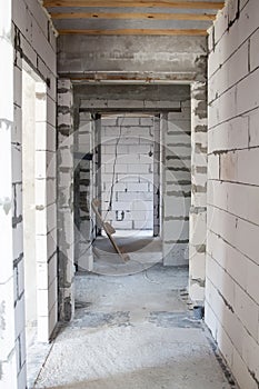 view of walls under construction of foam blocks in walls of country house