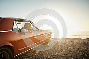 This view was worth driving for. a young woman enjoying a road trip along the coast.