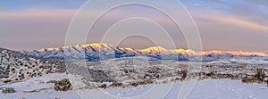 View of Wasatch Mountains at Mount Timpanogos, Eagle Mountain in Utah with brilliant sunlight on top