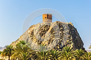 View of a watch tower behind the al riyam park in Muttrah district of Muscat, Oman....IMAGE