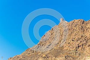 View of a watch tower on a hill in Muscat, Oman....IMAGE