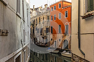 View of the  water channels, bridges and old palaces in Venice at sunrise during the lockdown