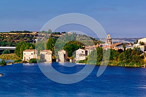 View of the water mills `AceÃÂ±as de Olivares`, old town and Douro river. Zamora, Spain. photo