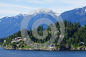 View from water of West Vancouver with high mountains on the background