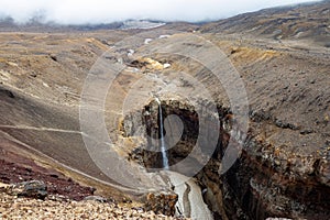 View of the waterfall in the canyon `Dangerous`. Kamchatka.