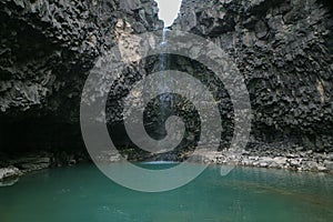 View of the waterfall in the cliff of columnar joints