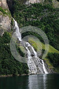 View of a waterfall among rocky rocks.