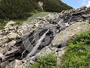 The view of waterfalls near Ribno lake in Pirin