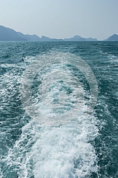 View of waves behind a boat