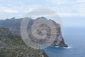 View on waves crashing against coastal cliffs at Mirador Es Colomer Formentor, Mallorca, Spain