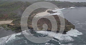 View of the waves crashing against the reef beside a beautiful beach with nice coral, raw footage, ungraded, no color, log