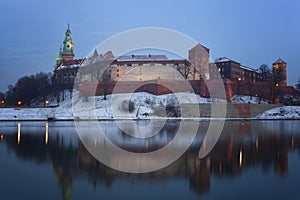 View of the Wawel castle and the Vistula River in Krakow in winter night