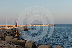 View of wea with green and red lighthouse