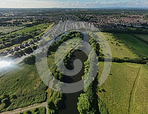 View of West Point, meadows, hairpin meander in River Mersey surrounded by plants, shrubs and trees