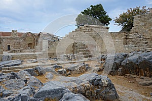 View on the west wing of the Hellenistic stoa and Greek Orthodox Church on the Acropolis of Lindos.