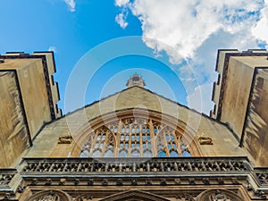 View of the Westminster Palace and the Houses of Parliament building facade against the blue sky, London, UK.