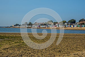 A view westward across a sand bar and the beach at West Mersea, UK photo