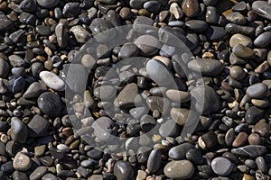 view on wet pebblestones on beach