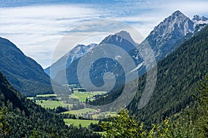 view on wetterstein mountains and leutasch valley from a nearby mountain in summer