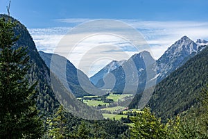 view on wetterstein mountains and leutasch valley from a nearby mountain in summer