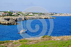 View on white boat on the beach Alcaufar, Menorca photo