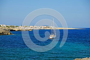 View on a white boat and the beach Alcaufar on Menorca photo