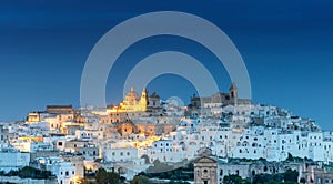 view of the white city of Ostuni just before sunrise