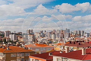 View of white clouds over turkish residential buildings in Istanbul