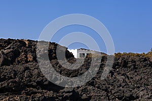 View of white house in the lava hill, Sicily