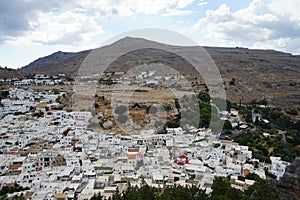 View of the white houses of the 16th-18th centuries from the ancient Acropolis of Lindos in August.