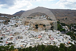 View of the white houses of the 16th-18th centuries from the ancient Acropolis of Lindos in August.