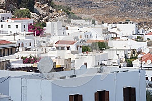 View of the white old houses of the 16th-18th centuries in ancient Lindos in August. Rhodes, Dodecanese, Greece.