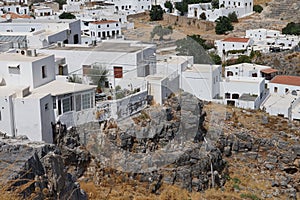 View of the white old houses of the 16th-18th centuries in ancient Lindos in August. Rhodes, Dodecanese, Greece.