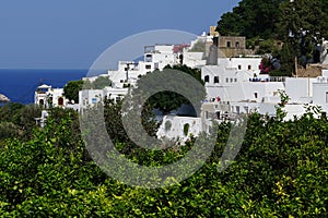 View of the white old houses of the 16th-18th centuries in ancient Lindos in August. Rhodes island, Greece