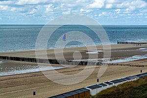 View on white sandy  beach, dunes and water of North sea between Vlissingen en Domburg, Zeeland, Netherlands