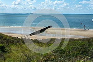 View on white sandy  beach, dunes and water of North sea between Vlissingen en Domburg, Zeeland, Netherlands