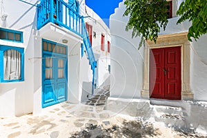 A view of whitewashed street with blue windows and doors in beautiful Mykonos town, Cyclades islands, Greece