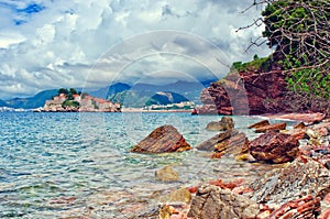 View from wild beach Crvena Glavica for Sveti Stefan island. Montenegro, Adriatic sea