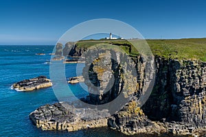 View of the wild Caithness coast and the Noss Head Lighthouse