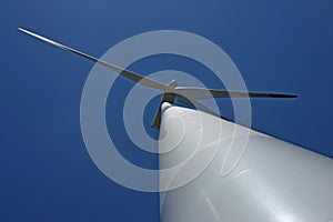 View of wind mill turbine from the ground