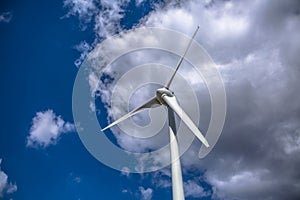 View of a wind turbine on top of mountains