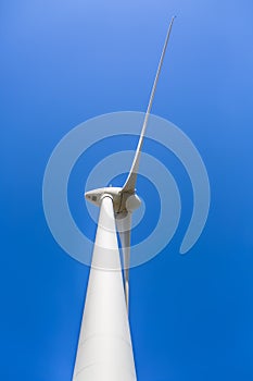 View of a wind turbine on top of mountains