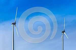 View of a wind turbines on top of mountains